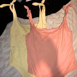 2 Medium Gaze bodysuits